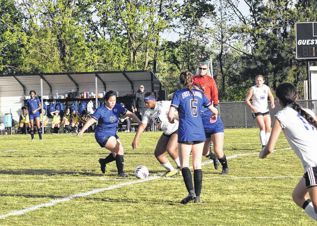 130624935_web1_GR_psoccer24 
			
				                                East Bladens Gabby Rebollar(center-left) challenging for a 50/50 ball.
                                 Alex Brooks | Bladen Journal