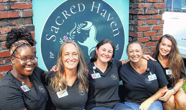 <p>The staff at Sacred Haven were at the grand opening of the Elizabethtown office. The staff consists of</p>
                                <p>Sacred Haven Midwifery with Jenny Ownbey - Certified Nurse Midwife & Practice Owner, Samantha Sands - Certified Nurse Midwife, Sydney Nadolny - Licensed Clinical Mental Health Counseling Associate and Certified Labor and Postpartum Doula, Bethany Nelson - Birth Assistant / Doula and Leigh Ann Hair - Administrative Assistant.</p>
                                 <p>Mark DeLap | Bladen Journal</p>
