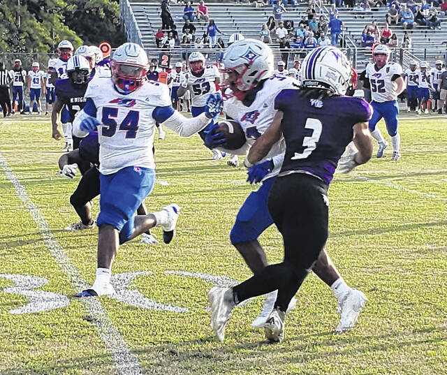 Penders Jaheim Lambe tries to elude the tackle by West Bladens Justin Spaulding (3).
                                 Sonny Jones / Bladen Journal