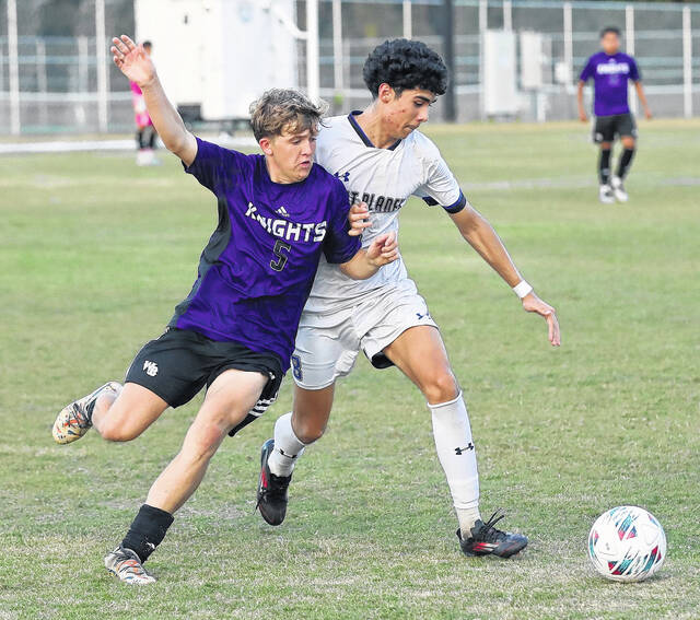 <p>West Bladen’s Jonah Bryan (5) and East Bladen’s Andrio Garcia (8) battle for the ball during Wednesday’s match.</p>
                                 <p>Kenneth Armstrong / kenarmphoto.com</p>