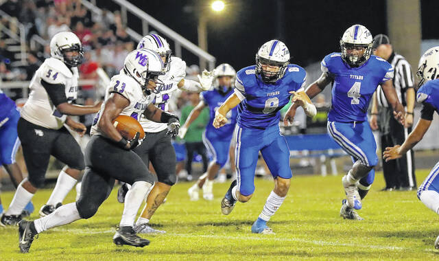 131782232_web1_West_Bladen_Trask_football_01
West Bladens Isaiah Robinson (23) looks for running room as Heide Trasks Jordyn Davis (8) and Kamajah Wilson (4) close in for the tackle.
Kenneth Armstrong / <a href="https://www.kenarmphoto.com/" target="_blank">kenarmphoto.com</a>