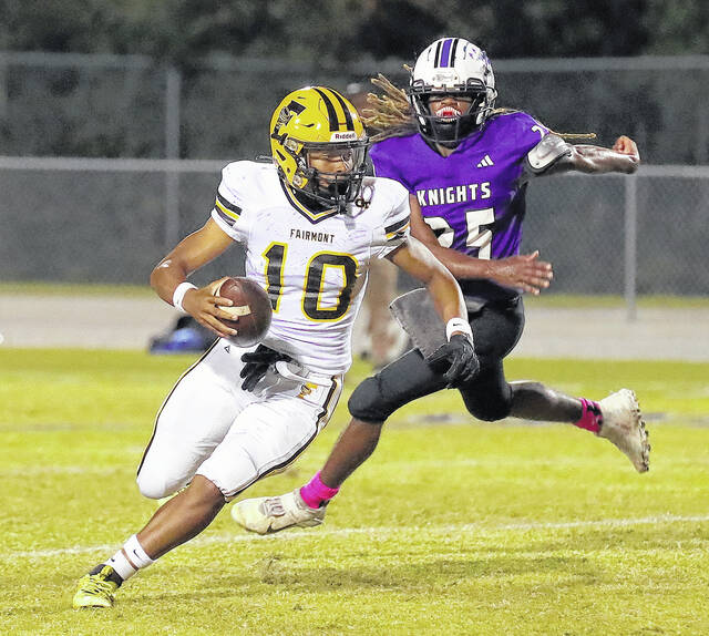 <p>Fairmont’s Jamarion Brown runs around the right side against West Bladen.</p>
<p>Kenneth Armstrong / kenarmphoto.com</p>