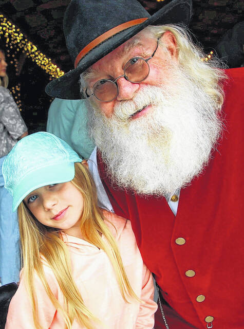 131849412_web1_stomp--1-
Visitors as far as the North Pole came out for the North Carolina Grape Festival at Lu Mil Vineyard Saturday. Needless to say, kids were on their best behavior as they were reminded that He knows when youre awake.
Mark DeLap | Bladen Journal