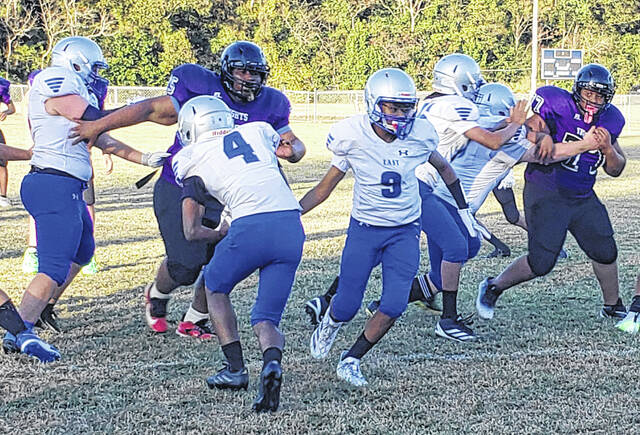 <p>The Bladen County middle school football jamboree Thursday featured West Bladen (purple) and East Bladen (white).</p>
                                 <p>Sonny Jones / Bladen Journal</p>
