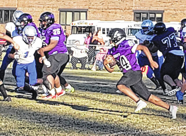 <p>The Bladen County middle school football jamboree Thursday featured West Bladen (purple) and East Bladen (white).</p>
                                 <p>Sonny Jones / Bladen Journal</p>