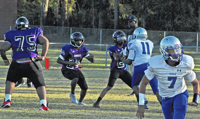 <p>The Bladen County middle school football jamboree Thursday featured West Bladen (purple) and East Bladen (white).</p>
                                 <p>Sonny Jones / Bladen Journal</p>
