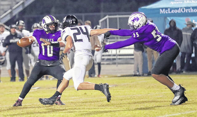 <p>West Bladen quarterback Devan Stanley (10) throws a pass Friday against South Columbus. Stanley connected with Keon Whittington on three touchdown passes.</p>
                                 <p>Kenneth Armstrong / kenarmphoto.com</p>