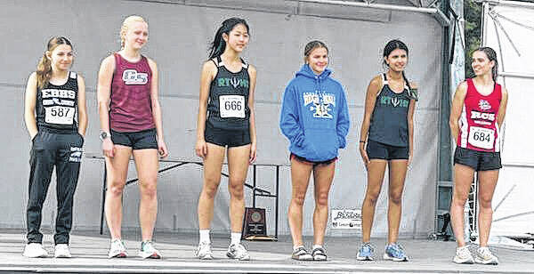 <p>East Bladen’s Aliah Jacobs, far left, on stage Saturday with other individual runners who qualified for the NCHSAA 2A cross country championship meet.</p>
<p>Contributed photo</p>
