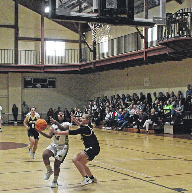 <p>Emereau: Bladen’s Zoe Hall (12) drives to the basket against a Sampson Middle player Monday.</p>
<p>Sonny Jones / Bladen Journal</p>