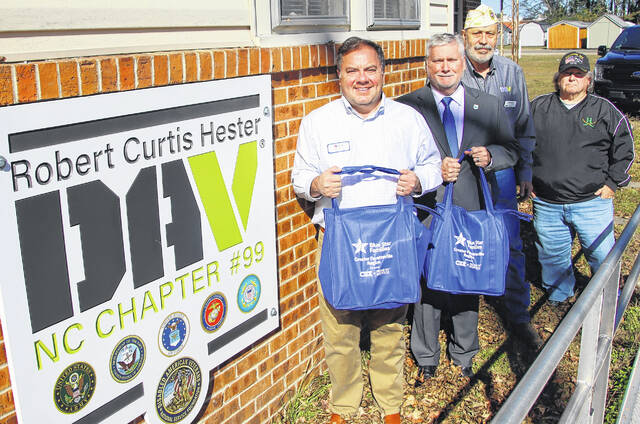 <p>Blue Star Executive Director Tate Johnson delivered 10 bags of food in the Nourish The Service food bundle to the DAV. Blue Star Families’ (BSF) partnership with the Robert Curtis Hester DAV Chapter 99 in Bladen County began a valuable partnership. From left, Tate Johnson - BSF, Sam Croom - Bladen County Manager, David Brown - DAV and Neill King - DAV.</p>