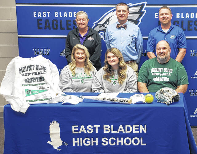 <p>Jenna Brice (front row, middle) with her parents, Joy Brice (left) and Jamie Brice (right) along with (back row, from left), East Bladen athletic director Patty Evers, principal Dr. Chris Carroll and softball coach Nathan Dowless at her signing ceremony.</p>
<p>Sonny Jones / Bladen Journal</p>