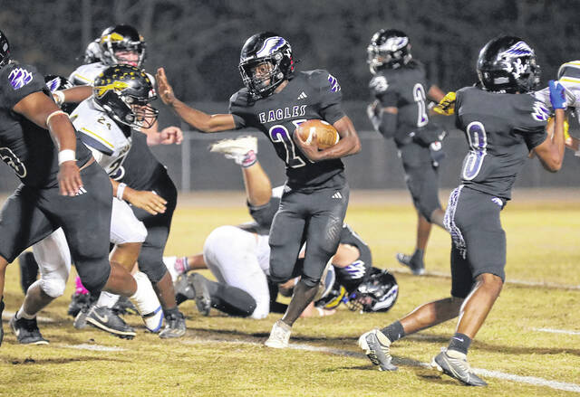 <p>East Bladen’s Jaden Lewis (21) ran for 169 yards, scored a touchdown and intercepted a pass in a 38-21 win Friday against Manteo.</p>
<p>Kenneth Armstrong / kenarmphoto.com</p>
