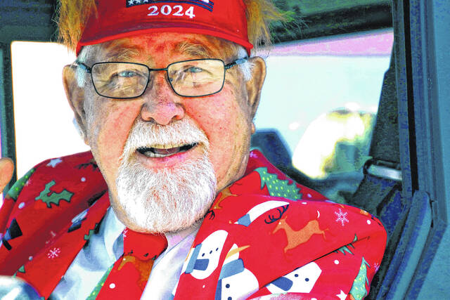 <p>Bladen County Commisser Charles Ray Peterson always has a festive suit just waiting for the holidays as he appears in the Bladenboro parade.</p>