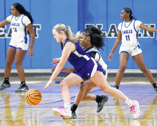 <p>West Bladen’s Kali Allen dribbles the basketball while being guarded by East Bladen’s Ariel Cromartie.</p>
<p>Kenneth Armstrong / kenarmphoto.com</p>