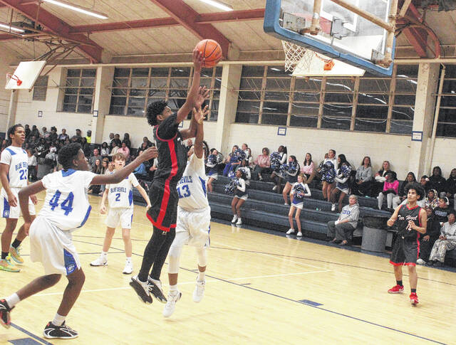 132082828_web1_Tar_Heel_Clarkton_boys_01
Tar Heels Derion Parker (1o) goes up for a shot against Clarktons Markel Jacobs (13).
Sonny Jones / Bladen Journal