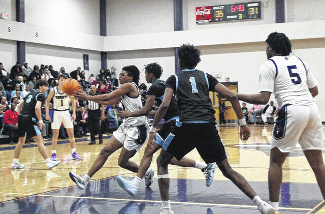 132136528_web1_021326_West_Bladen_South_Bruns_boys_01
West Bladens Tylik McCall (4) drives the lane against South Brunswick on Friday, Feb. 13.
Sonny Jones / Bladen Journal