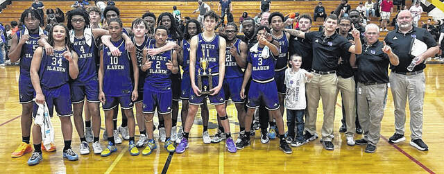 The West Bladen boys basketball team received the trophy Friday night for winning the Southeastern Conference tournament championship.
                                 Contributed photo