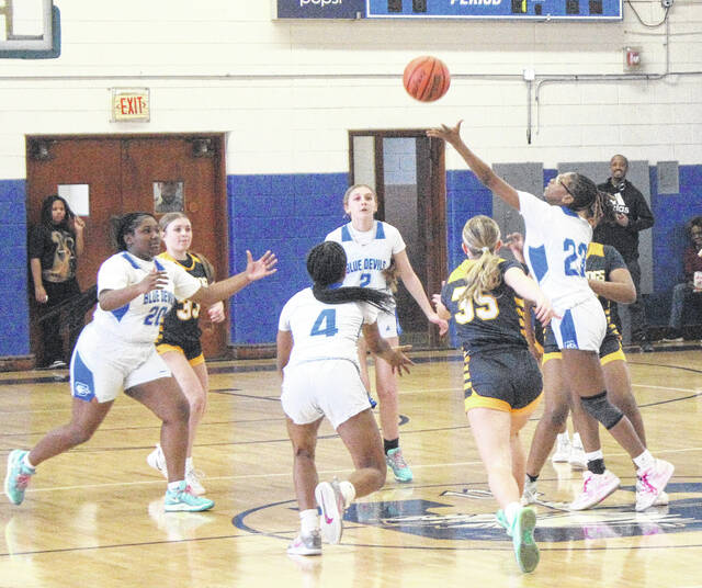 <p>Bladenboro (blue) and Clarkton (white) players battle for the loose ball following the opening tip.</p>
<p>Sonny Jones / Bladen Journal</p>