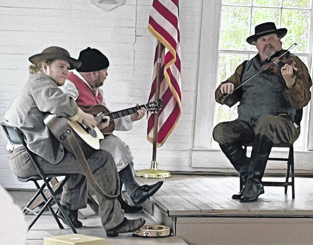 The Huckleberry Brothers Band entertain visitors inside the chapel at Harmony Hall Village Plantation.
Jenna Dove / Bladen Journal
