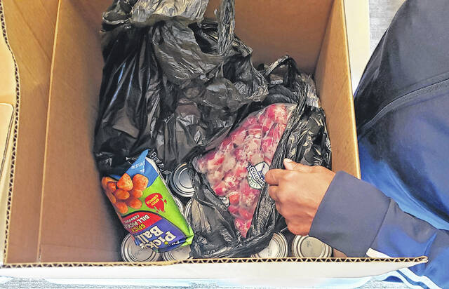 Some of the food people received during the Joy Fellowship Outreach Ministrys giveaway.
                                 Sonny Jones / Bladen Journal