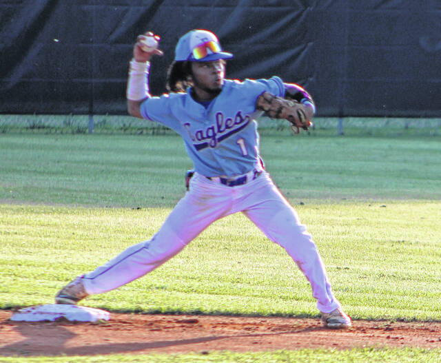 East Bladen second baseman Braylon Cromartie makes a throw to first base against Clinton.
                                 Xavier Potts / East Bladen journalism class