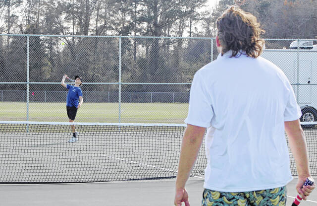 East Bladens Greigh Butler serves to West Bladens Jude Culbreth.