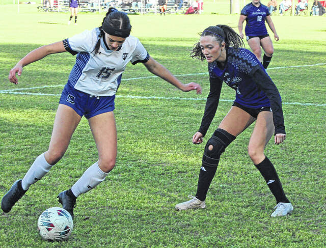 East Bladens Kayelynn Chambers dribbles the ball as West Bladens Makenna Thurman defends.