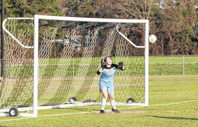 East Bladen keeper Aubri Nixon attempts to make a save off a West Bladen free kick early in the match.