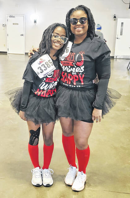 14-year-old Saamiyae Lofton and her mother, Ashley Lofton, dressed in tutus for Saturdays Wine Run 5k.
                                 Sonny Jones / Bladen Journal