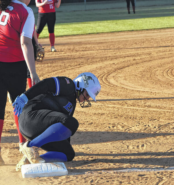 An East Bladen softball player slides safely into third base against Union.
                                 Xavier Potts / East Bladen journalism class