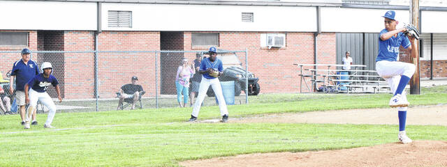 Bladenboros Oxciel Campos takes a lead off third base as Clarktons Aiden Wooten delivers a pitch.
                                 Sonny Jones / Bladen Journal