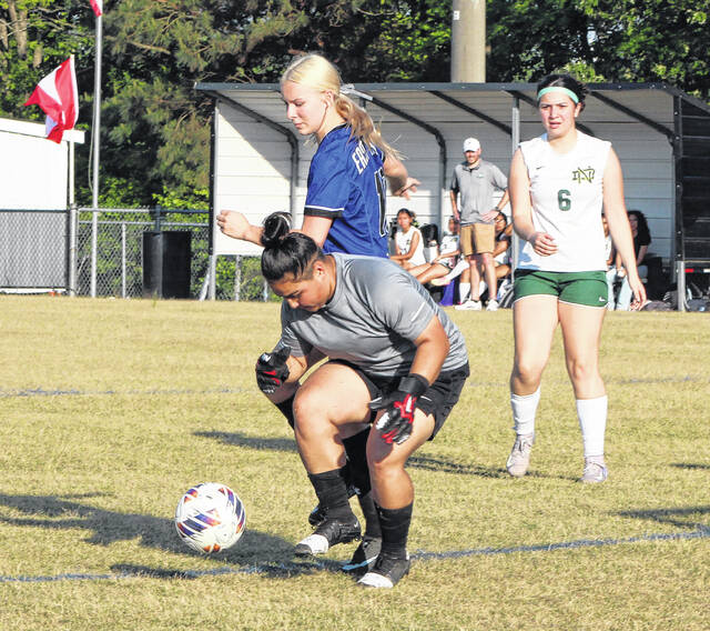 East Bladens Maylin McMichael (blue jersey) gets tangled up with the North Duplin goalkeeper.
                                 Sonny Jones / Bladen Journal