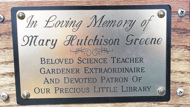 This plaque is on the bench that was dedicated Monday, April 13 outside the Bladen County Library in Elizabethtown.
                                 Sonny Jones / Bladen Journal