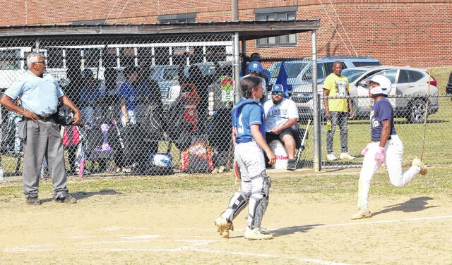 Bladenboros Oxciel Campos (right) heads toward home plate after hitting an inside-the-park home run against Clarkton.
                                 Sonny Jones / Bladen Journal