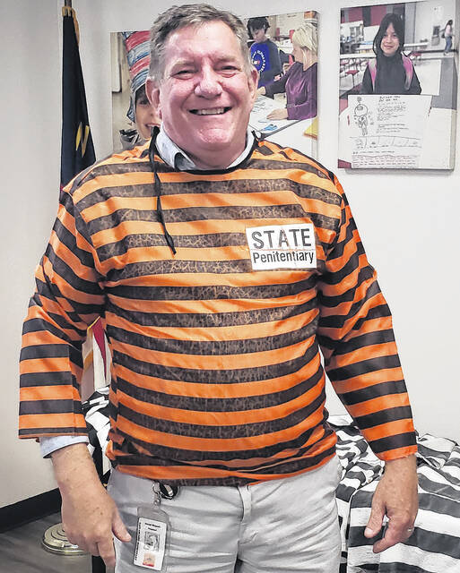 East Arcadia principal David Wimert dons his prison stripes prior to making bail during the Bladen County Educational Foundation Jail-A-Thon on Thursday, April 23.
                                 Sonny Jones / Bladen Journal