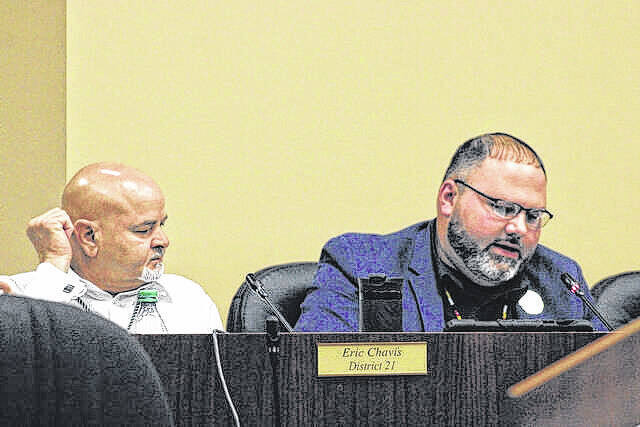 Lumbee Tribal Councilman Rudy Locklear, right, the chairman of the Constitution and Ordinance Committee, speaks during the Thursday, April 16 Tribal Council meeting in Pembroke, as Councilman Eric Chavis, left, looks on
                                 Chris Stiles / The Robesonian