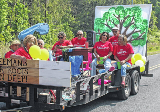 Members of the Freemans ride on a float during the SpringFest parade.
                                 Sonny Jones / Bladen Journal