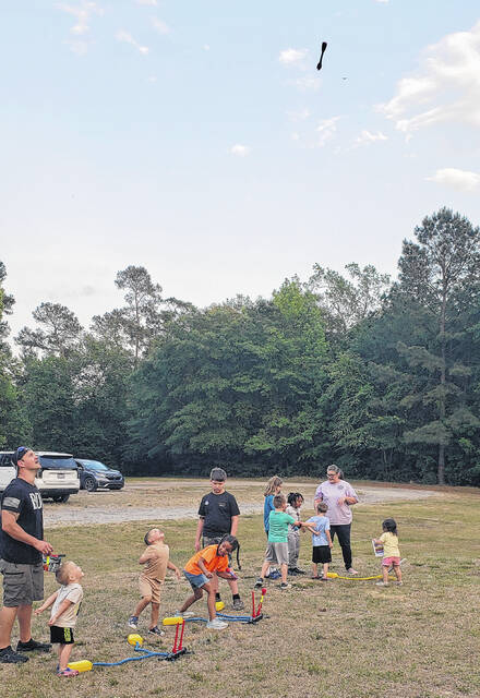 Children send foam Stomp Rockets skyward.
                                 Sonny Jones / Bladen Journal