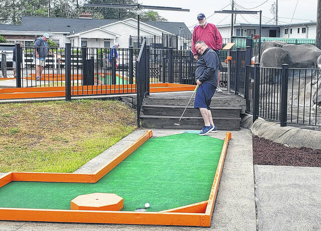 A player urges his ball to go in the hole on No. 18 during the Professional Putters Association tournament Sunday, April 26 at White Lakes Grand Regal Resort.
Sonny Jones / Bladen Journal