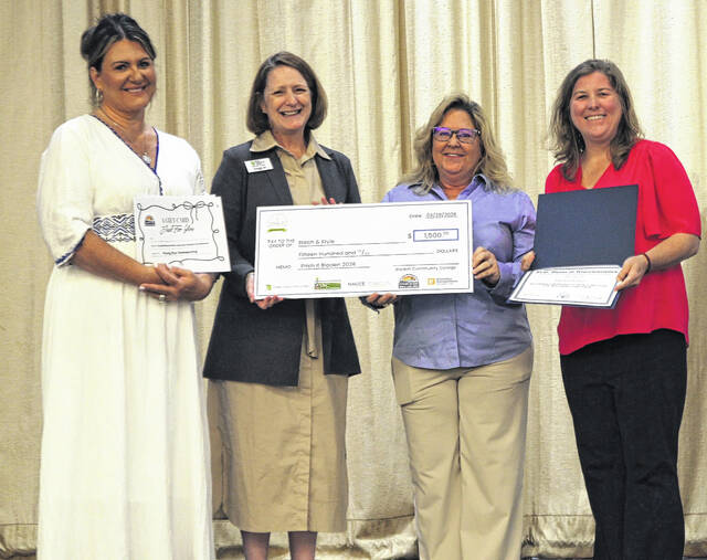 Jeane Pope Bordeaux of Stitch & Style was the winner of Pitch It Bladen County. Pictured, from left, Elizabethtown-White Lake Chamber of Commerce manager Amy Hudson, Bladen Community College President Dr. Amanda Lee, Pope Bordeaux and Katie Smith from U.S. Rep. David Rouzers office.
                                 BCC photo
