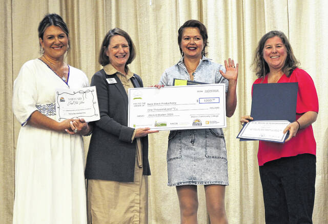 Rebecca Allen of Beck Black Producation was awarded second place in Pitch It Bladen County. Pictured, from left, Elizabethtown-White Lake Chamber of Commerce manager Amy Hudson, Bladen Community College President Dr. Amanda Lee, Allen and Katie Smith from U.S. Rep. David Rouzers office.
                                 BCC photo