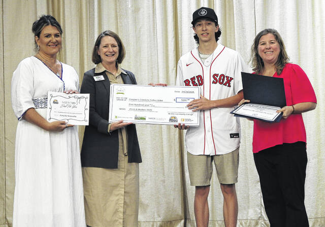 Cooper Mills of Coopers Cards & Collectibles was awarded third place in Pitch It Bladen County. Pictured, from left, Elizabethtown-White Lake Chamber of Commerce manager Amy Hudson, Bladen Community College President Dr. Amanda Lee, Mills and Katie Smith from U.S. Rep. David Rouzers office.
                                 BCC photo