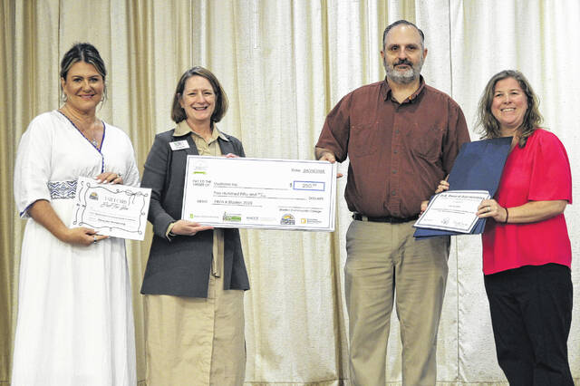 Sean Swoboda of VoxNova Inc. was awarded fourth place in Pitch It Bladen County. Pictured, from left, Elizabethtown-White Lake Chamber of Commerce manager Amy Hudson, Bladen Community College President Dr. Amanda Lee, Swoboda and Katie Smith from U.S. Rep. David Rouzers office.
                                 BCC photo