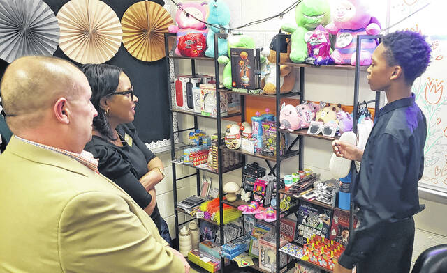 A student shows some of the items available at the Cougar Family Hub.
                                 Sonny Jones / Bladen Journal