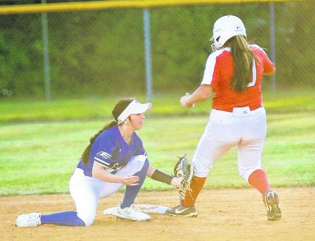 East Bladen shortstop Tatum Allen tags out a Union runner at second base.
                                 Kenneth Armstrong / kenarmphoto.com
