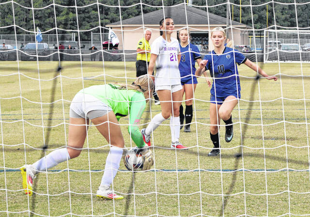 East Bladens Maylin McMichael (10) runs toward the ball as the Rosewood keeper makes a save.
                                 Sonny Jones / Bladen Journal
