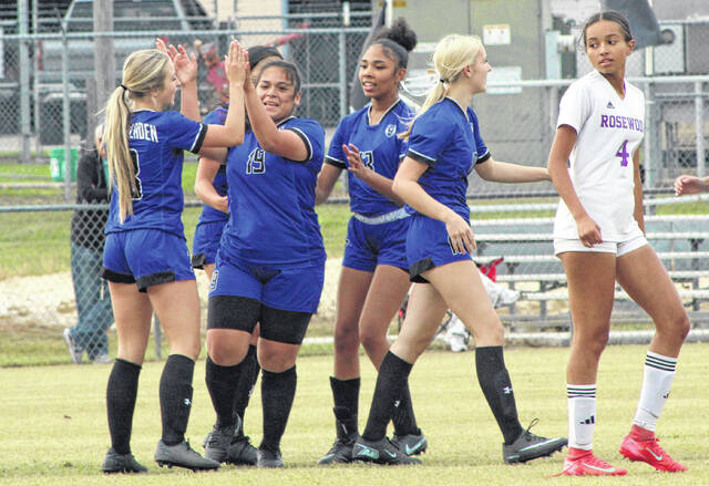 East Bladens Gabby Rebollar (19) is congratulated by teammates after scoring on a penalty kick.
                                 Sonny Jones / Bladen Journal