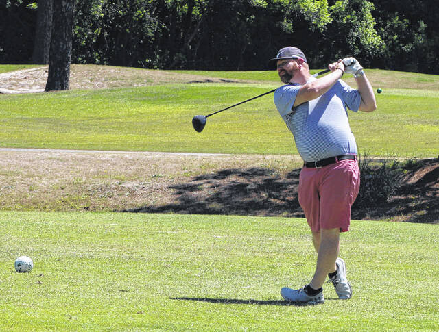 A golfer tees off on the first hole during the Elizabethtown Rotary Club Scholarship Tournament at Vineyard Golf at White Lake.
Sonny Jones / Bladen Journal