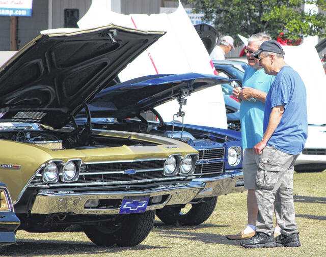 Two men check out some of the cars at the cruise-in held on the grounds of Lake Church.
Sonny Jones / Bladen Journal