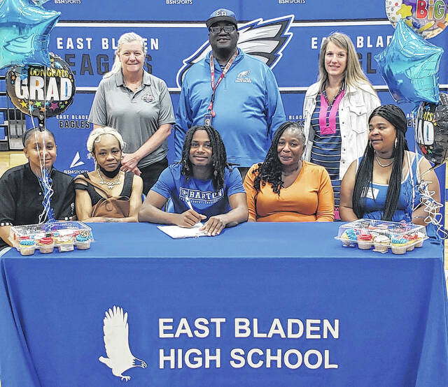 East Bladen athlete Tevin McLean (center) signed to participate in track at Barton College during a ceremony Wednesday, May 20 attended by family and coaches.
Sonny Jones / Bladen Journal
